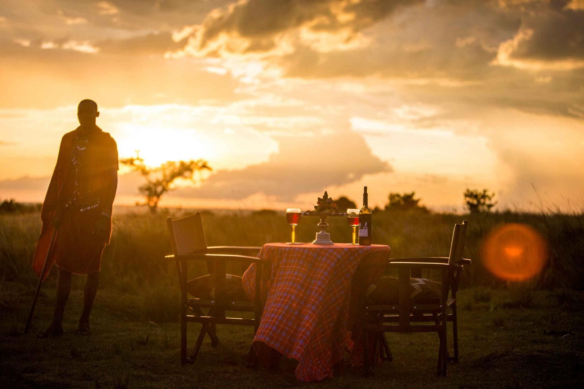 Couple on private game drive sunset Kenya Tanzania